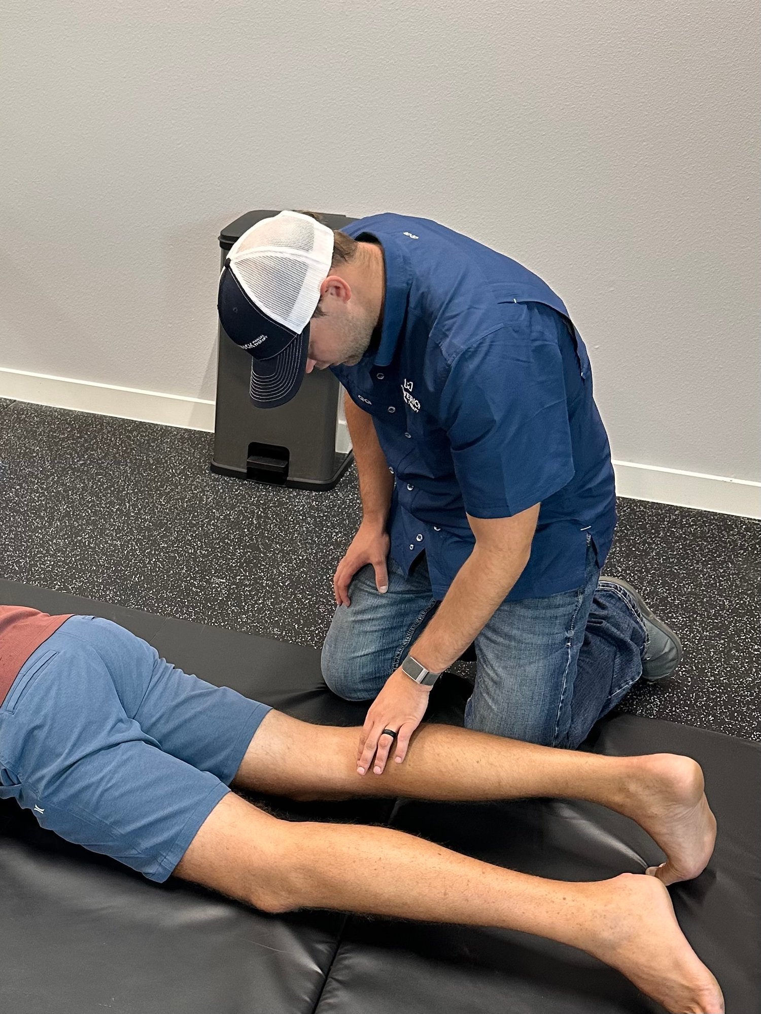 Physical therapist treating meniscus tear and knee cartilage damage with manual therapy in San Antonio clinic