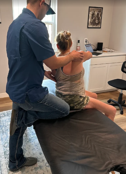 Physical therapist treating herniated disc and sciatica with specialized manual therapy in San Antonio clinic
